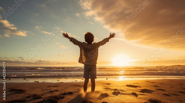 Fototapeta child on beach at sunset enjoying and having fun. summer and vacation