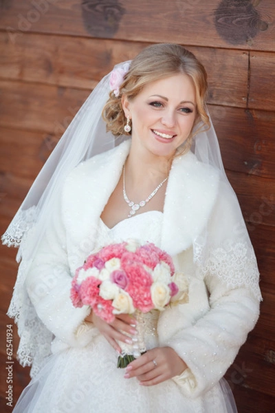 Fototapeta Beautiful Bride in wedding day outdoors