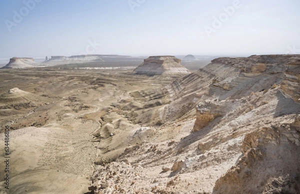 Obraz Panorama of hills and ridges with limestone and chalk slopes in the Kazakh steppe, relief folds in the desert tract of Boszhira