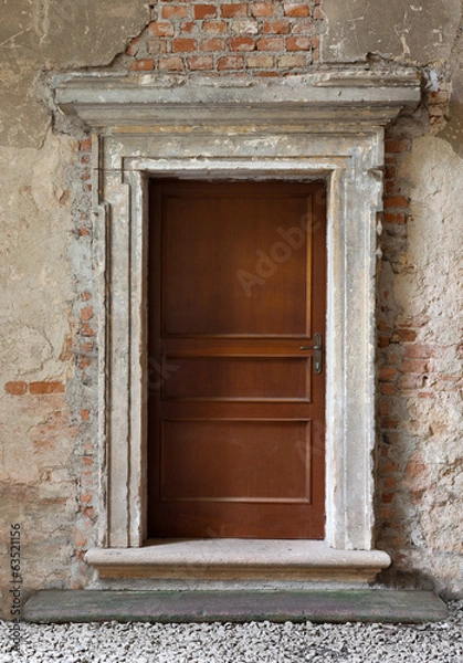 Fototapeta old wood made doors on abandoned background