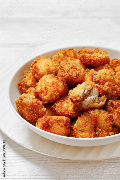 Fototapeta crispy fried panko breaded chicken bites in bowl