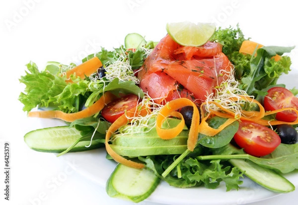 Fototapeta Smoked salmon and avocado salad, isolated on white.  