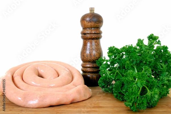 Fototapeta chipolata sausage on cutting board, white background, 