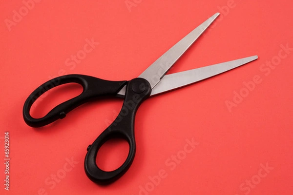 Fototapeta Scissors On A Red Background