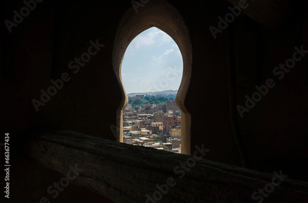 Fototapeta Cairo city view framed with the window of the minaret tower of Sultan Qansuh Al-Ghuri Complex, Dense buildings Egypt