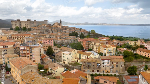 Fototapeta Aerial view of Bracciano, in the metropolitan city of Rome, Italy. The town is located on the shores of Lake Bracciano. In the historic center there is the castle and cathedral of Santo Stefano.