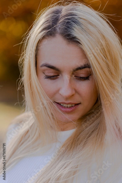 Fototapeta Beautiful Blonde Woman Close-Up Portrait in Fall Setting Outside - Autumn Elegance