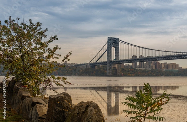 Fototapeta A distance view of George Washington Bridge in the evening from the  Palisades Interstate Park in New Jersey