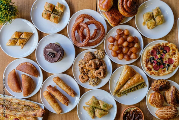 Fototapeta A picture from above of a table with dishes of traditional Turkish sweets and pastries