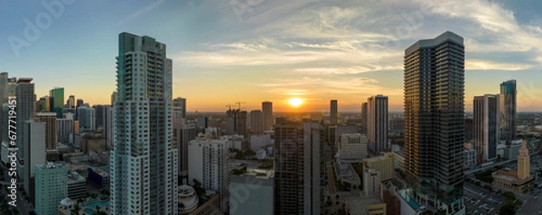 Fototapeta Aerial view of downtown office district of Miami Brickell in Florida, USA at sunset. High commercial and residential skyscraper buildings in modern american megapolis