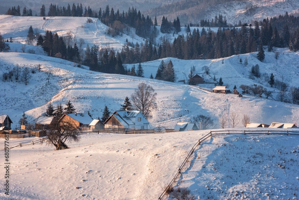 Fototapeta Scenic view of high mountain village in the Carpathians with wooden houses, winter landscape, outdoor travel background