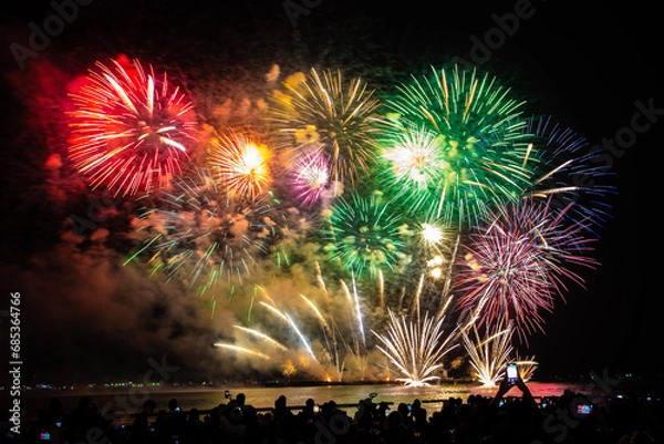 Fototapeta Colorful fireworks, beautiful like stars, black sky, Pattaya beach fireworks, New Year's festival and tourism festival.