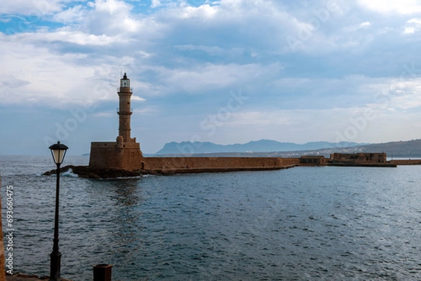 Fototapeta Crete Greece. Lighthouse, beacon at Venetian harbour in Old Town of Chania