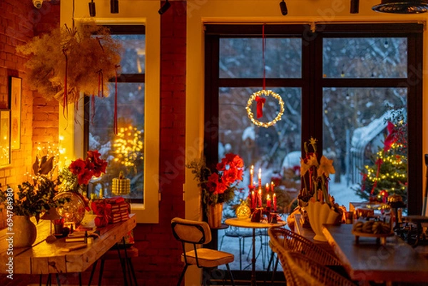 Fototapeta Beautifully decorated table for a New Year's holidays at cozy home during festive evening