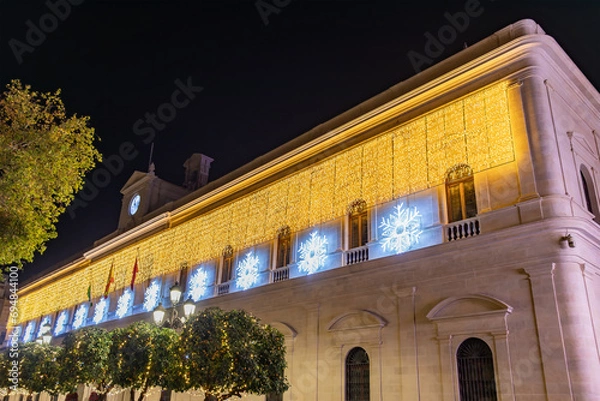 Obraz Christmas lights decoration in the facade of Seville City Hall, Andalusia, Spain. Selective focus with focus in the nearest lights