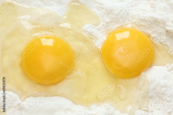 Obraz Two egg yolks and flour