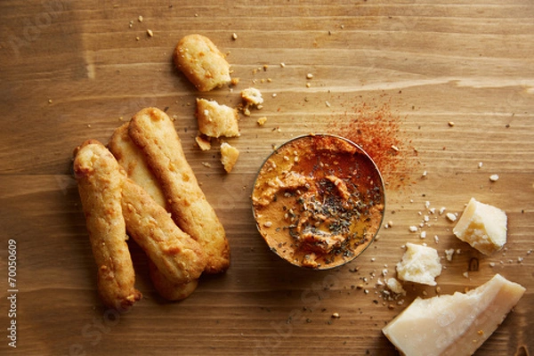 Fototapeta Cheese sticks with dry tomato hummus