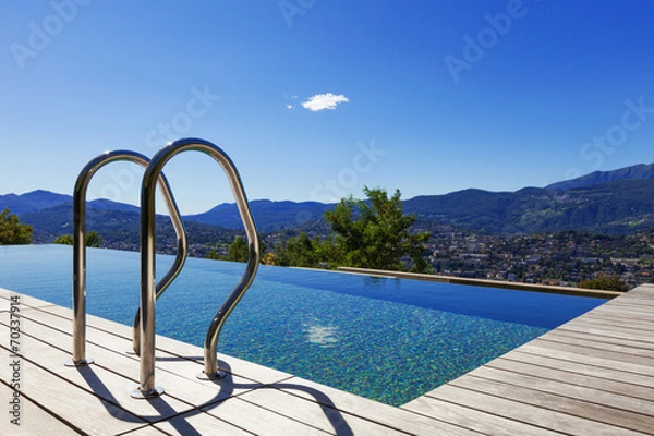 Fototapeta Grab bars ladder in the swimming pool