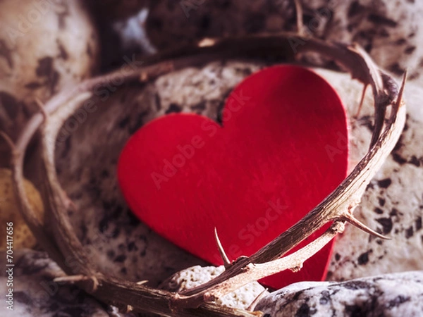 Fototapeta Lent, Holy Week, Good Friday, Easter Sunday Concept - Crown of thorns with blurry red heart shape and stone background.