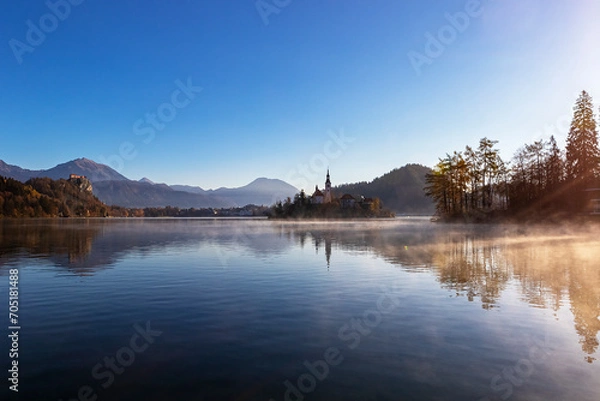 Fototapeta Bled lake in autumn morning, scenic view of Bled Island and Bled castle