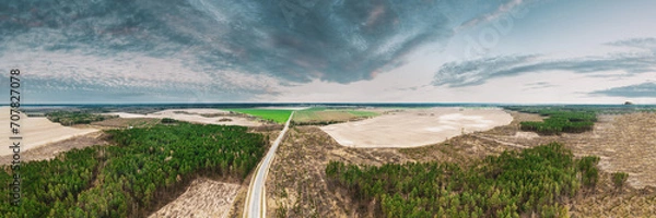 Fototapeta Aerial View Of Highway Road Through Deforestation Area Landscape. Green Pine Forest In Deforestation Zone. Top View Of Field And Forest Landscape. Drone View. Bird's Eye View