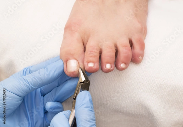 Fototapeta process of pedicure at beauty salon