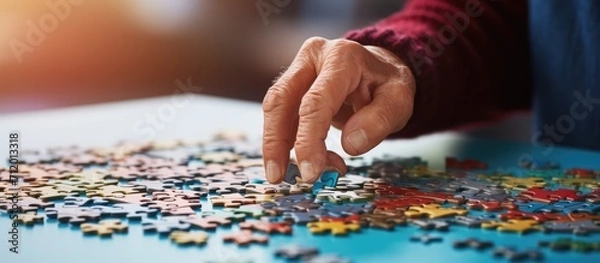 Fototapeta close up of hand with puzzle. Teamwork concept