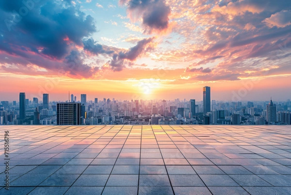 Fototapeta Empty square floors and city skyline with sky clouds at sunset