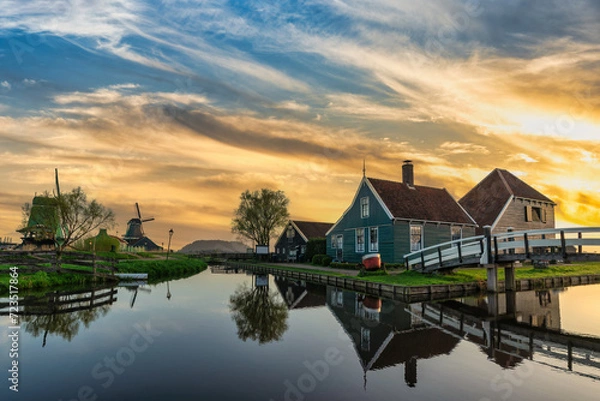 Fototapeta Sunrise at Zaanse Schans village with Dutch Windmill near Amsterdam Netherlands