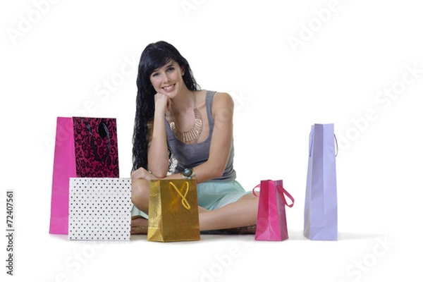 Fototapeta Young attractive shopper girl sitting with purchases