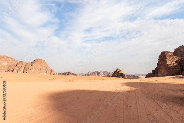 Fototapeta The unforgettable beauty of vast expanse of endless sandy red desert of the Wadi Rum near Amman in Jordan