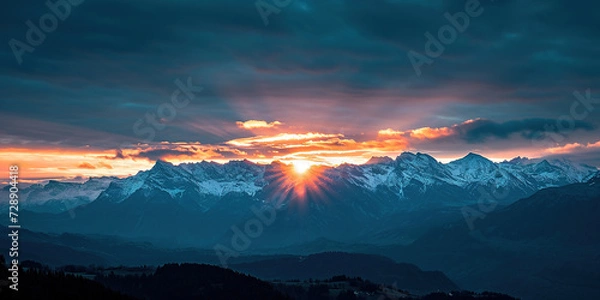 Fototapeta Swiss Alps snowy mountain range with valleys and meadows, countryside in Switzerland landscape. Golden hour majestic fiery sunset sky, travel destination wallpaper background