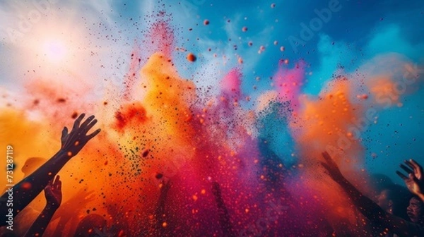 Fototapeta Vibrant images showcasing people throwing bright colored powders in the air during the Holi festival