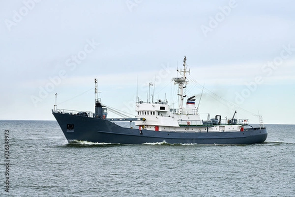 Fototapeta Russian warship armed with armament sails into sea toward military target to attack and destroy enemy, military ship performing strategic maneuver, Russian sea power deployment for tactical advantage