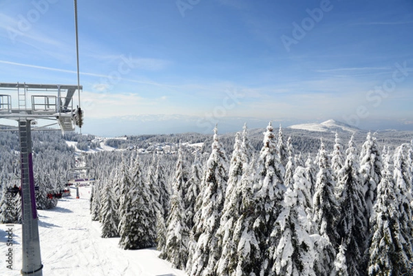 Fototapeta The mountain slope with chair lift