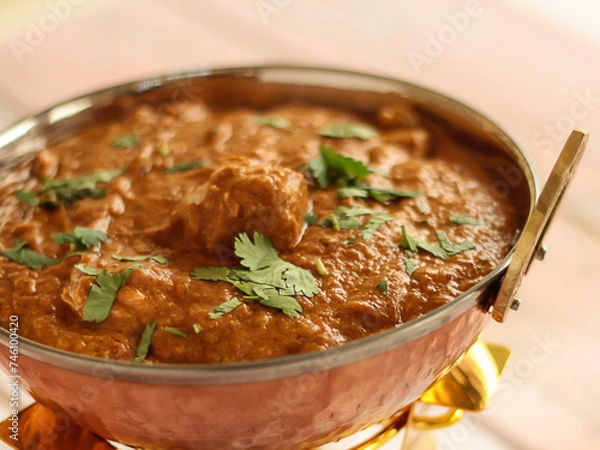 Fototapeta CHICKEN TANDOORI KORMA MASALA served in karahi isolated on table closeup top view of indian spices food