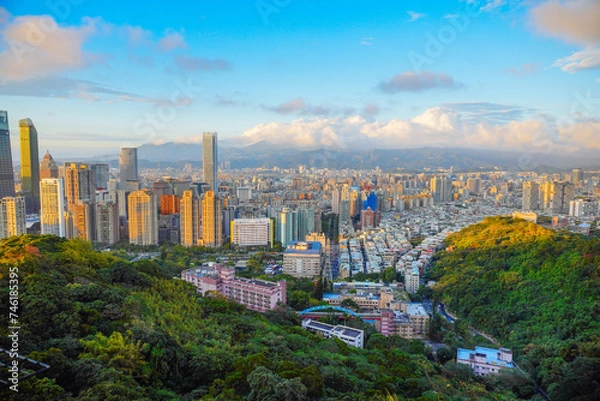 Fototapeta Taipei, Taiwan, Republic of China, 01 21 2024: Taipei City (in Republic of China, Taiwan) and mountain at sun set seen from elephant mountain park