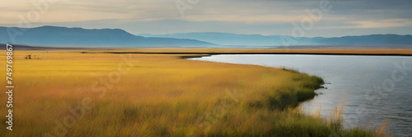 Fototapeta Guided Horizon: Expansive Grassland Leading to Distant Lake. 3:1 Banners and Landscape Backgrounds, Perfect for Expansive Visual Themes