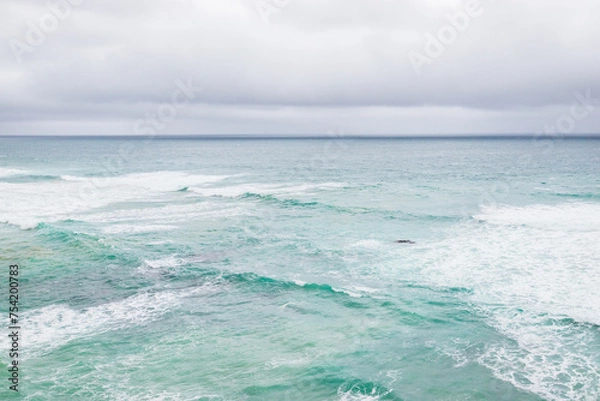 Fototapeta Whispers of Time on the Apostles’ Shoreline, Australia