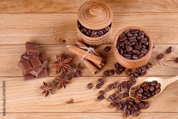 Fototapeta Coffee in a pot on a wooden background