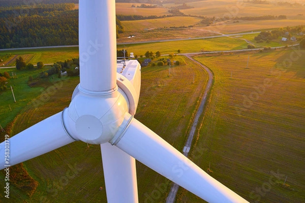 Fototapeta Close-up of a modern wind turbine. Backlit aerial photography