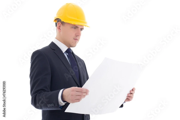 Fototapeta portrait of handsome business man in yellow builder's helmet wit