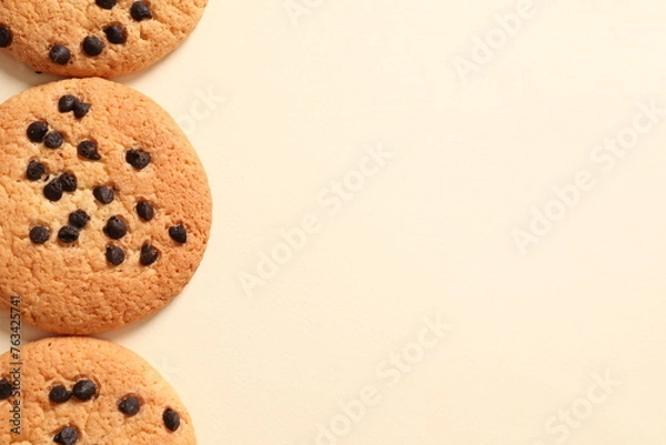 Fototapeta Cookies with chocolates on a colored background
