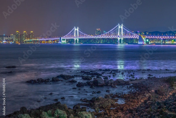 Fototapeta The night view of Haeundae Beach in Busan, South Korea, where you can see Gwanghan Bridge.