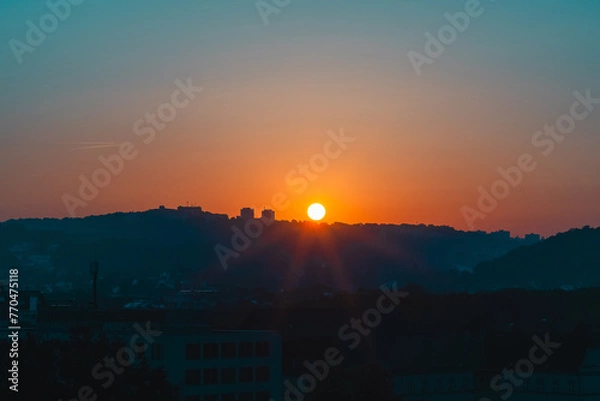 Fototapeta Sun rising over the mountain horizon landscape