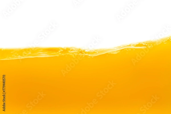 Fototapeta The surface of the orange water ripples looks like beer.