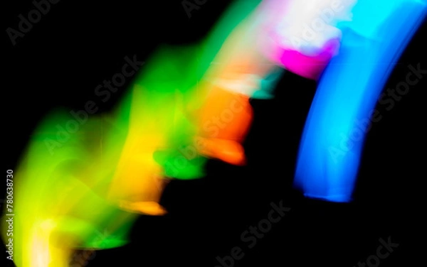 Fototapeta Abstract colorful irregular lines background. Long exposure. Light painting photography.