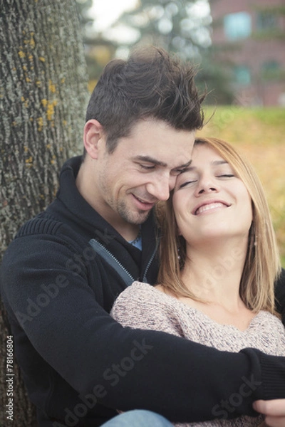 Fototapeta A Young happy couple in autumn season