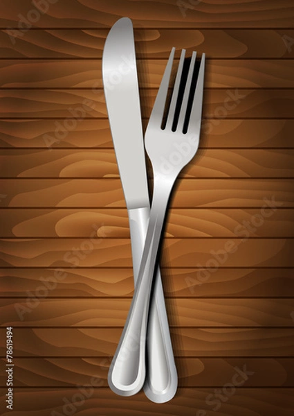 Fototapeta Fork and knife on wooden background for your design