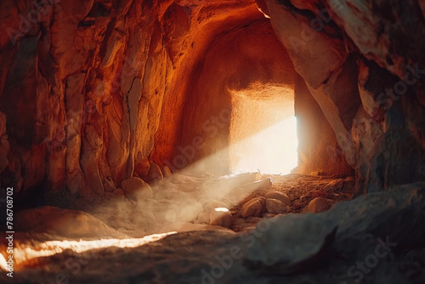 Fototapeta Empty tomb with stone rocky cave and light rays bursting from within. Easter resurrection of Jesus Christ. Christianity, faith, religious, Christian Easter concept